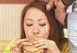 asian girl cum on her face while eating a burger