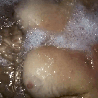 boobs floating in soapy bath water