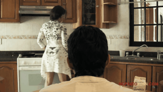 woman bends over in kitchen boy with mask strange gif